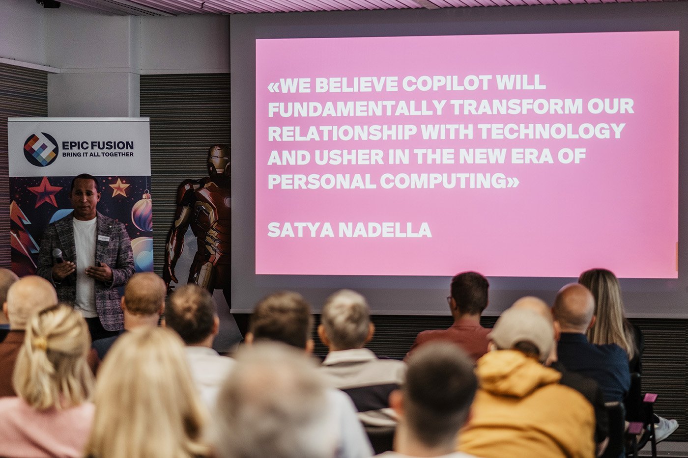 Screen mit Quote von Satya Nadella am Epic Fusion Kundenevent 2024 zu Copilot X-Mas Event