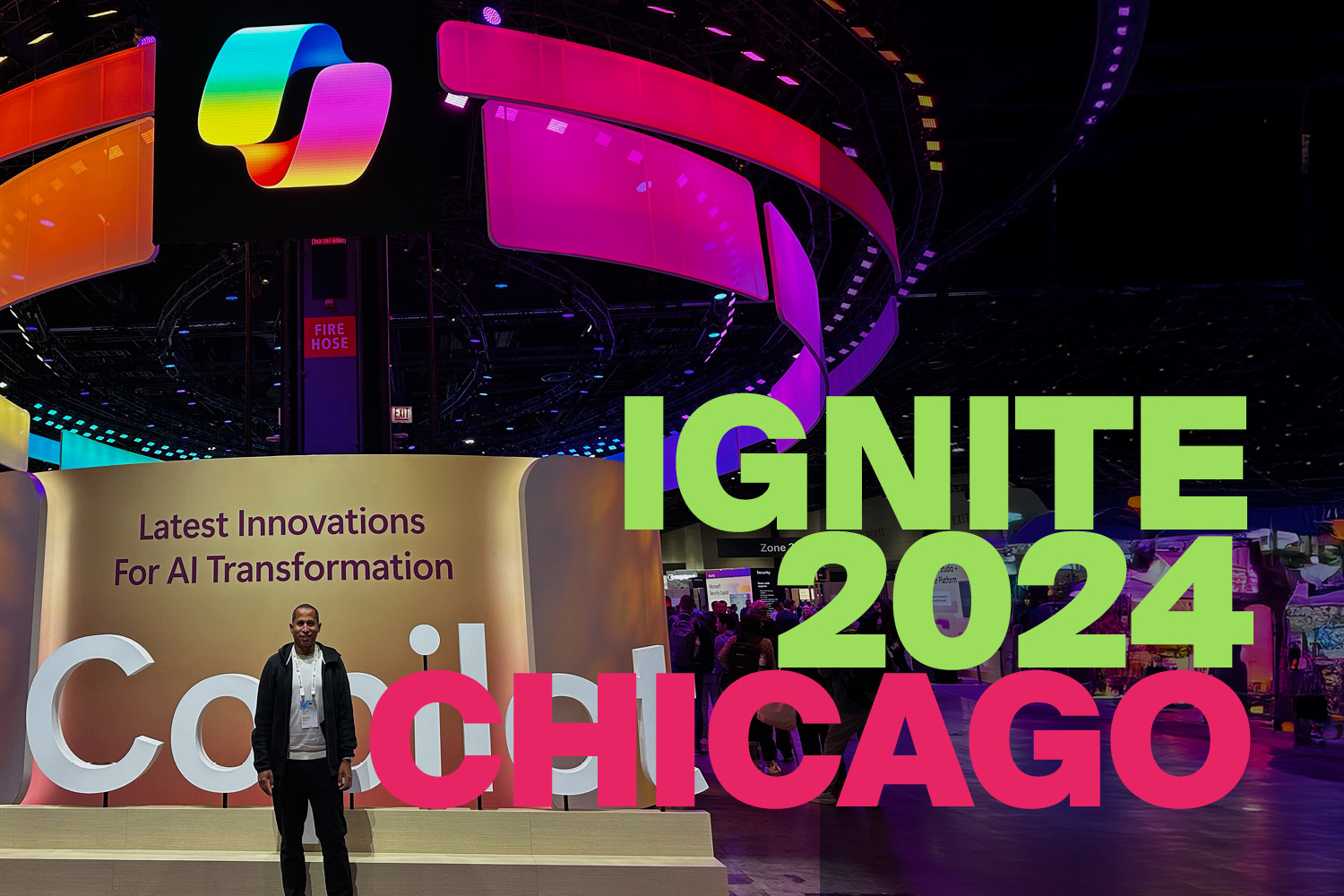 Sanche Baskaran at Microsoft Ignite 2024 in Chicago, standing in front of the central Microsoft Ignite logo.